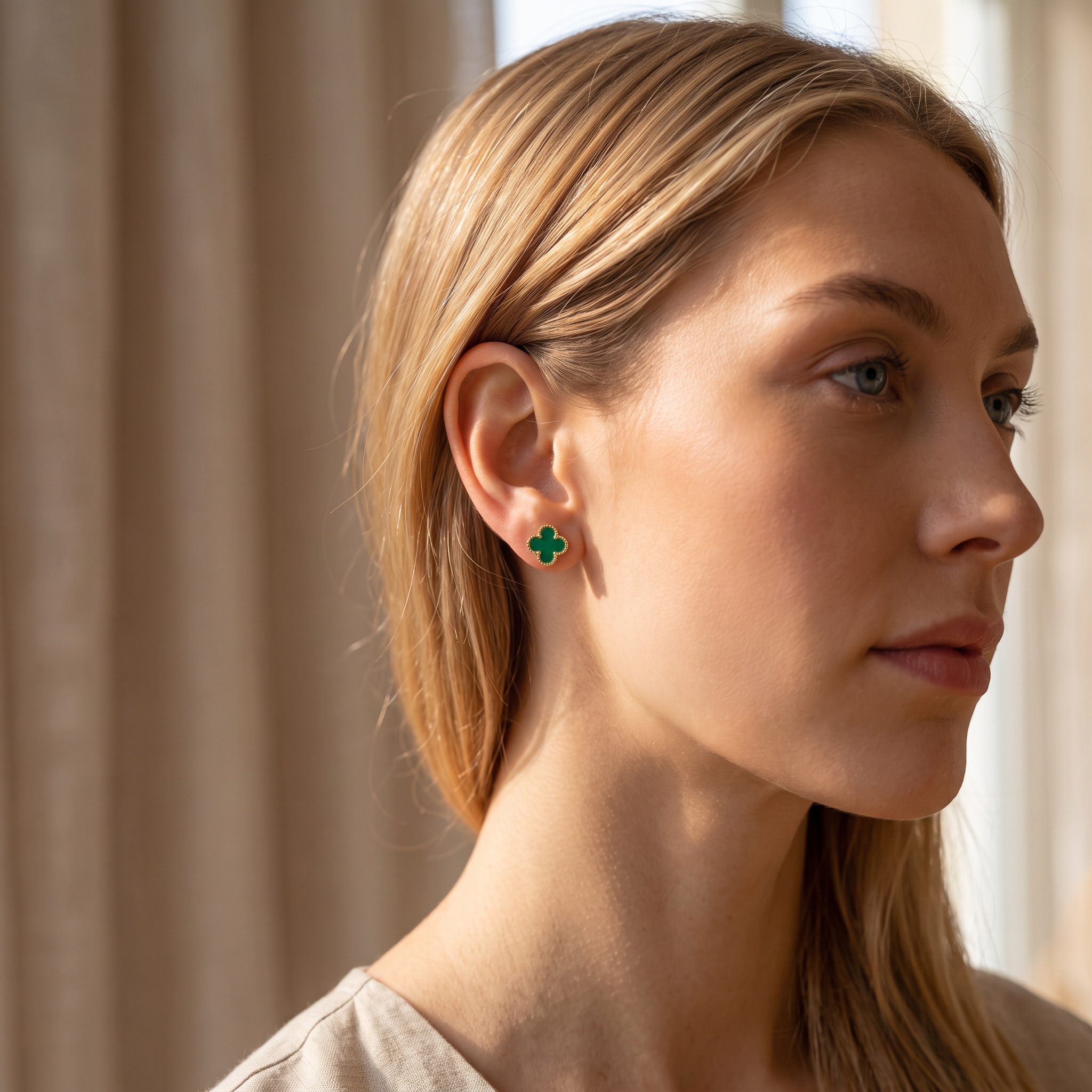 TRIANON clover stud worn — gold and green clover earring