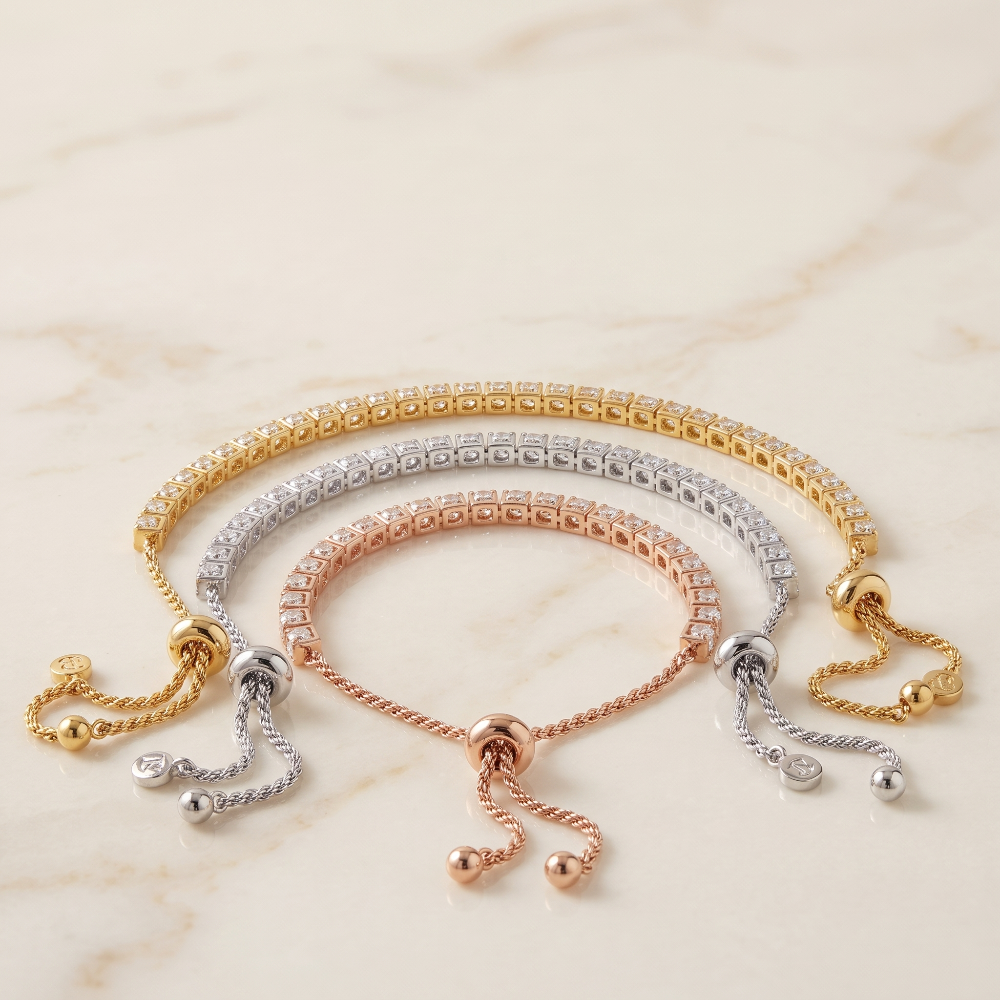 MONTE-CARLO Tennis Bracelet — gold, silver and rose gold on cream marble